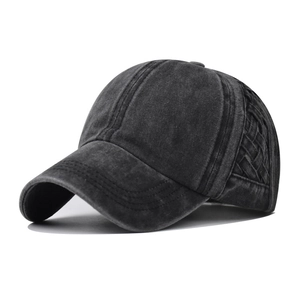 Close-up of vintage washed cotton fabric and braided mesh details on baseball cap