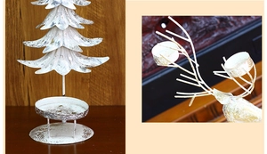 Detailansicht weißer Vintage-Metall-Weihnachtskerzenhalter in Baum- und Rentierform