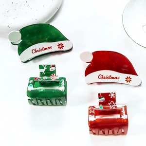 Christmas hair claw clips set with red Santa hat shapes and festive patterns
