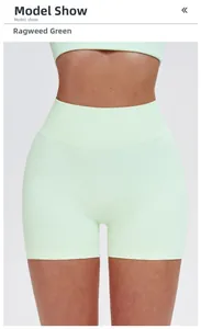 Detailed front view of seamless high-waisted fitness shorts in mint green showing ribbing