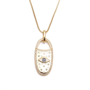 Gold pendant necklace featuring a blue evil eye design and embedded zircon crystals