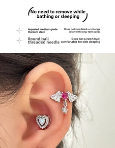 Detailed view of medical grade titanium steel heart stud with zircon wings and screw ball back