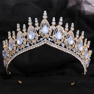 Close-up of golden bridal crown with light blue teardrop stones and clear crystals