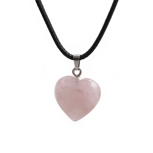 Handcrafted rose quartz heart pendant necklace with black woven cord on white background