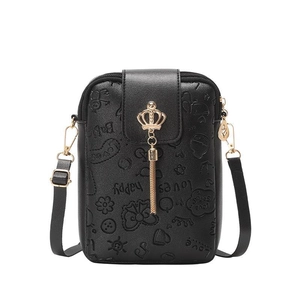 Black embossed crossbody phone bag with crown decor and adjustable shoulder strap