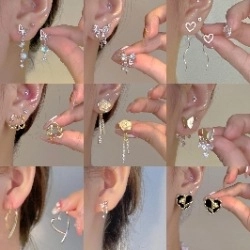 Collection of star and floral earrings featuring silver and gold finishes with zircons