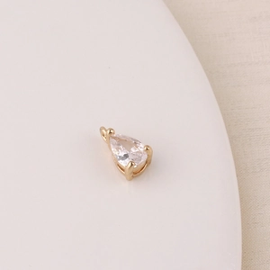Macro shot of gold-plated teardrop zircon pendant for DIY jewelry making