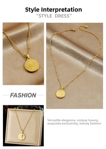 Detailed views of gold coin pendant necklace with beaded chain on satin fabric