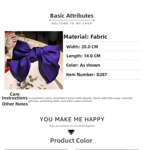 Detailed view of large purple silk bow clip with dimensions 20cm by 14cm for styling