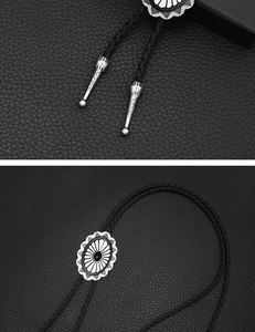 Detail of silver Celtic Bolo Tie showing sunburst slider and black braided leather cord