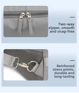 Detail of grey functional backpack with durable metal zippers and breathable mesh back