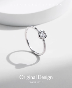Detail shot of heart-cut Moissanite stone set in S925 sterling silver ring band