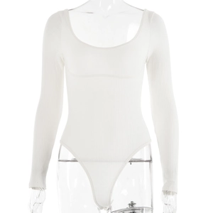 Close-up detail of white ribbed cotton bodysuit fabric and long sleeve cuff textures