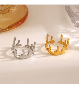 Detailed view of lava-style molten rings in polished 18K gold and silver finishes