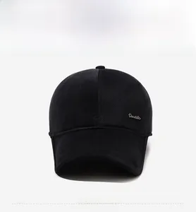 Detail of black winter baseball cap with Donatello metal plate and textured warm fabric