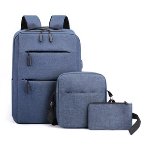 Blue-grey three-piece set with a large business backpack, shoulder bag, and small clutch