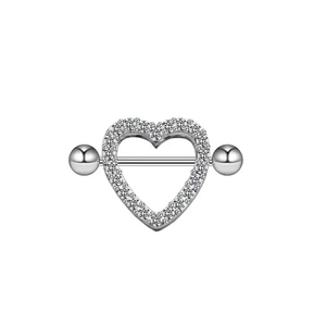 Detailed view of silver heart nipple shield set with sparkling clear cubic zirconia