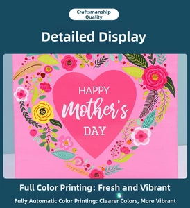 Detail view of pink gift bag with vibrant floral heart and Happy Mother's Day text