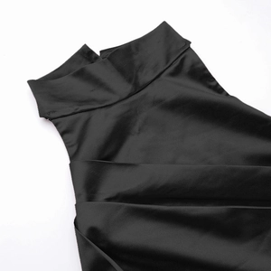Detail shot of black satin dress with stand collar and elegant high-neck halter design