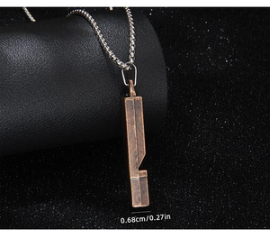 Detail of vintage functional whistle pendant on black background showing 0.68cm width