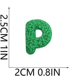 Macro detail of 2.5cm green chenille alphabet P patch with fluffy towel embroidery texture