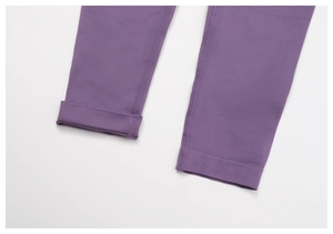Detail view of purple yoga leggings showing high-elastic knit fabric and precision stitching