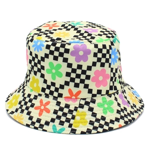 Close-up of colorful floral print on black and white checkered reversible bucket hat