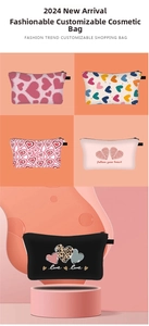 Detailed view of various heart-patterned cosmetic bags with sturdy zipper and carrying loop