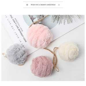 Detailed texture of pink and grey faux fur pompom ornaments with pearl and hemp rope accents