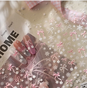 Detailed view of TS-4263 3D embossed nail stickers featuring pink bow and snowflake designs