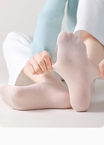 Close-up of pink mulberry silk socks showing breathable knit mesh and elastic texture