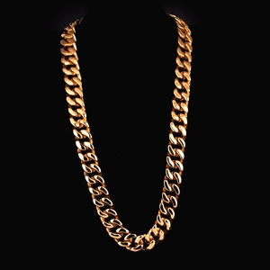Polished gold stainless steel Cuban link chain necklace for men on a black background