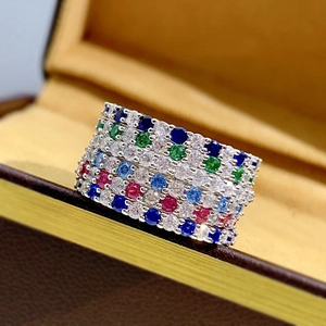Detailed close-up of five S925 silver rings with colorful zircon stones in a jewelry box