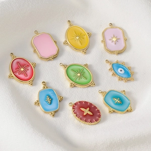 Detailed group view of colorful 14k gold plated enamel eye and celestial charm pendants