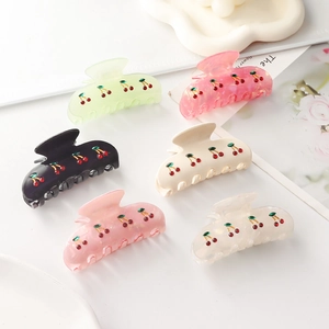 Sweet cherry hair claws in six colors displayed on a white background for styling