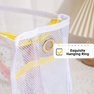 Close-up of the fine white mesh waterproof beach bag with a round gold metal hanging ring