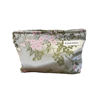 Sage green satin floral makeup bag with pink flowers on a clean white background