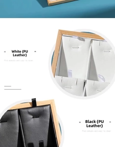 Detailed view of bamboo wood jewelry tray with white and black PU leather inserts