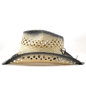 Detail of hand-woven straw cowboy hat with gradient color and diamond hollow patterns