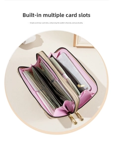 Detail of pink striped wallet interior showing multiple card slots and dual zipper pockets