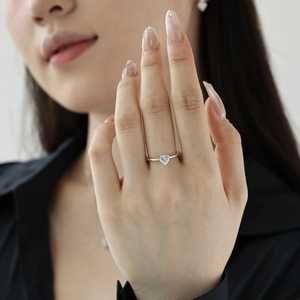 Elegant S925 sterling silver ring with a heart-shaped gemstone worn on a model's finger