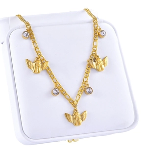 Golden angel necklace with zircon charms and Figaro chain displayed in a white jewelry box