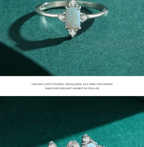 Macro detail of silver ring featuring rectangle opal stone and brilliant side zircons