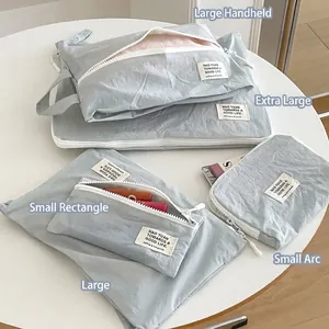 Set de bolsas de viaje de nailon azul claro impermeable en varios tamaños para ropa