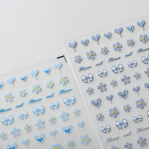 Pale blue 3D nail art stickers with heart, flower, and bow designs for manicure decor