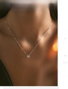 Close-up of S925 sterling silver heart pendant with shimmering pavé cubic zirconia