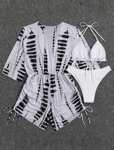 Detailed flat lay of white three-piece bikini set with tie-dye print mesh cover-up