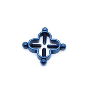 Detail of adjustable deep blue stainless steel cross nipple clamp with four screw bolts