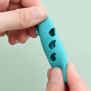 Close-up of flexible cyan silicone handle cover being stretched to show high elasticity