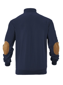 Detail of navy waffle knit jacket with brown suede elbow patches on a stand collar design